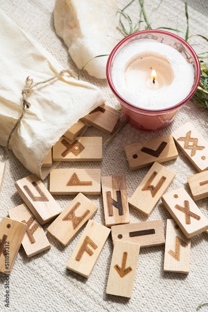 ON THE NATURAL LINEN FABRIC THERE ARE TRADITIONAL WOODEN RUNES LIKE ...