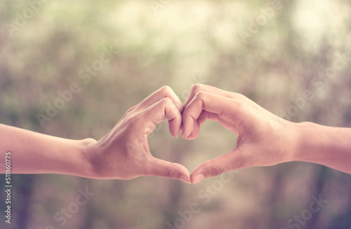hands in shape of love heart vintage  © lerm90
