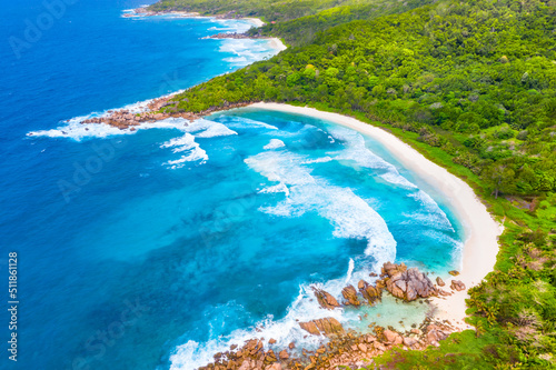 In the foreground is the tropical beach of Anse Cocos, then the beaches of Petit Anse and Grand Anse. La Digue, Seychelles photo