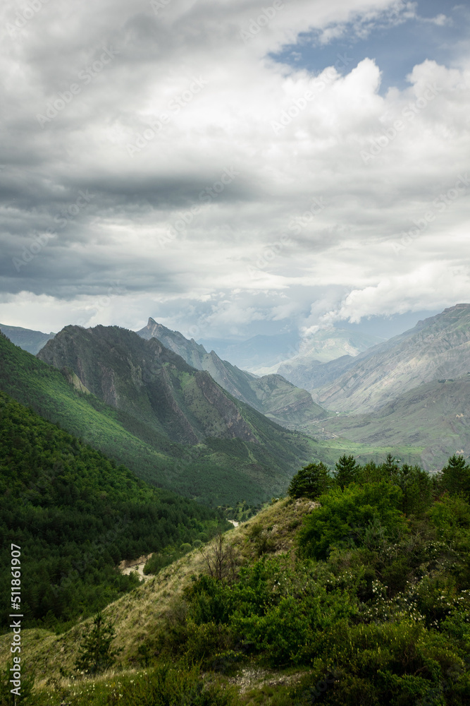 A high-resolution panorama of a beautiful summer view of the mountains. Thunderclouds over the mountains in Dagestan