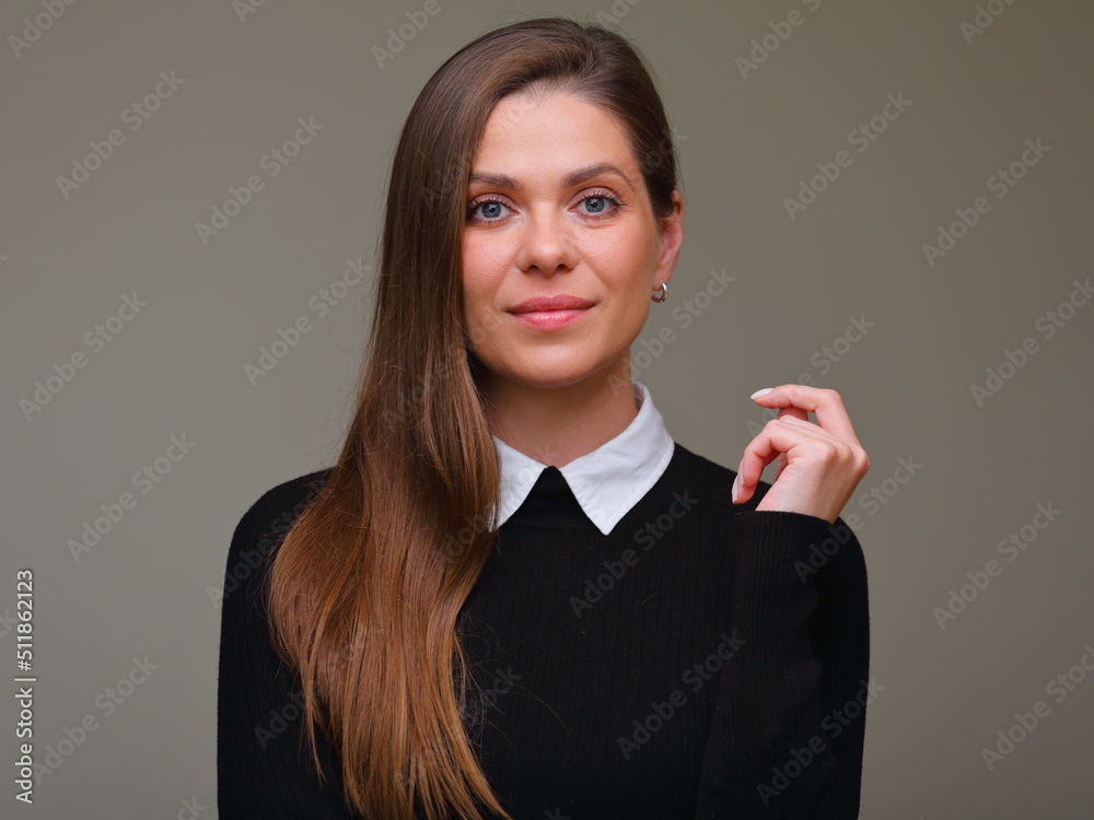 Smiling woman in black sweater holding hand up near face, isolated female portrait. Smiling woman in black sweater holding hand up near face, isolated female portrait.