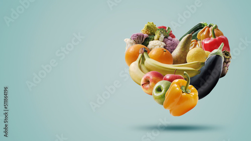 Fototapeta Naklejka Na Ścianę i Meble -  Fruits and vegetables arranged in a heart shape
