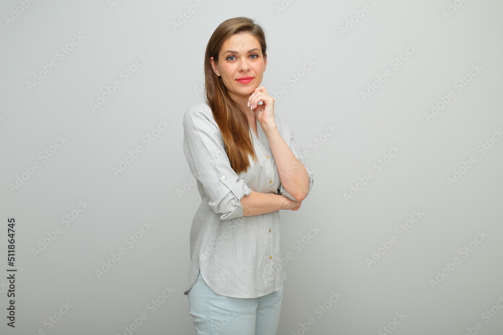 Thinking woman isolated portrait, young lady dressed pants and gray shirt. Thinking woman isolated portrait, young lady dressed pants and gray shirt.
