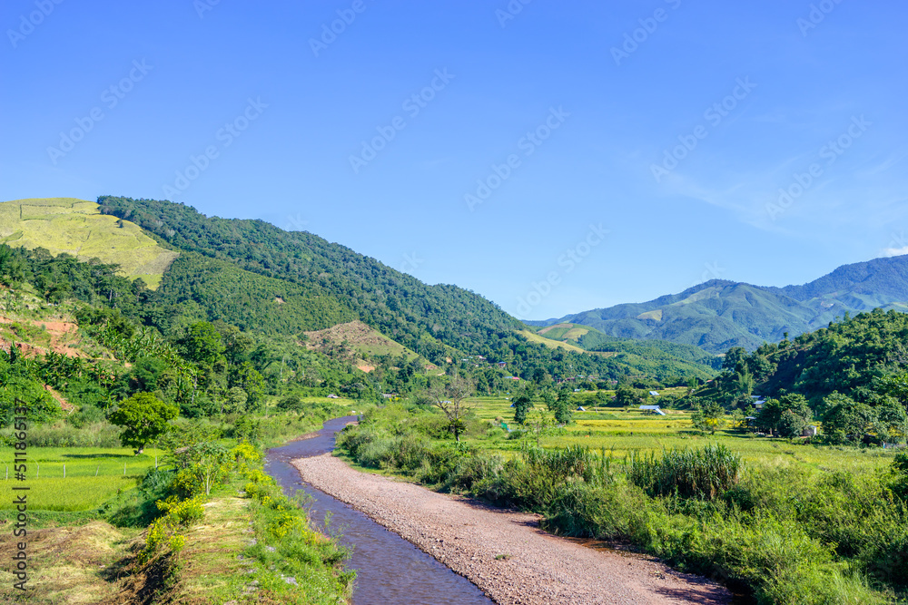 Water flow from the river in the countryside hometown in Sapun, Nan, Thailand.