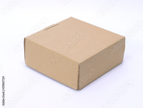 The cardboard packaging box is light brown on a white background. © Нелик Дулатов