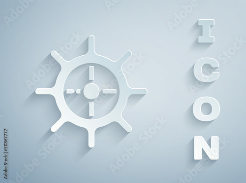 Paper cut Ship steering wheel icon isolated on grey background. Paper art style. Vector