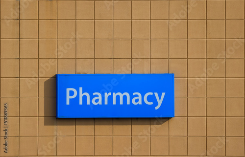 Pharmacy sign at storefront. Facade of a Drugstore.