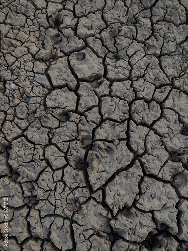 Cracked earth, cracked soil. texture of grungy dry cracking parched earth. Global worming effect.