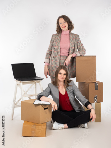 Women with boxes. Successfu...