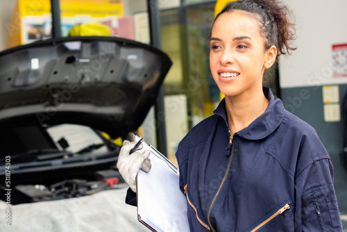 African mechanic woman ready to work at garage.