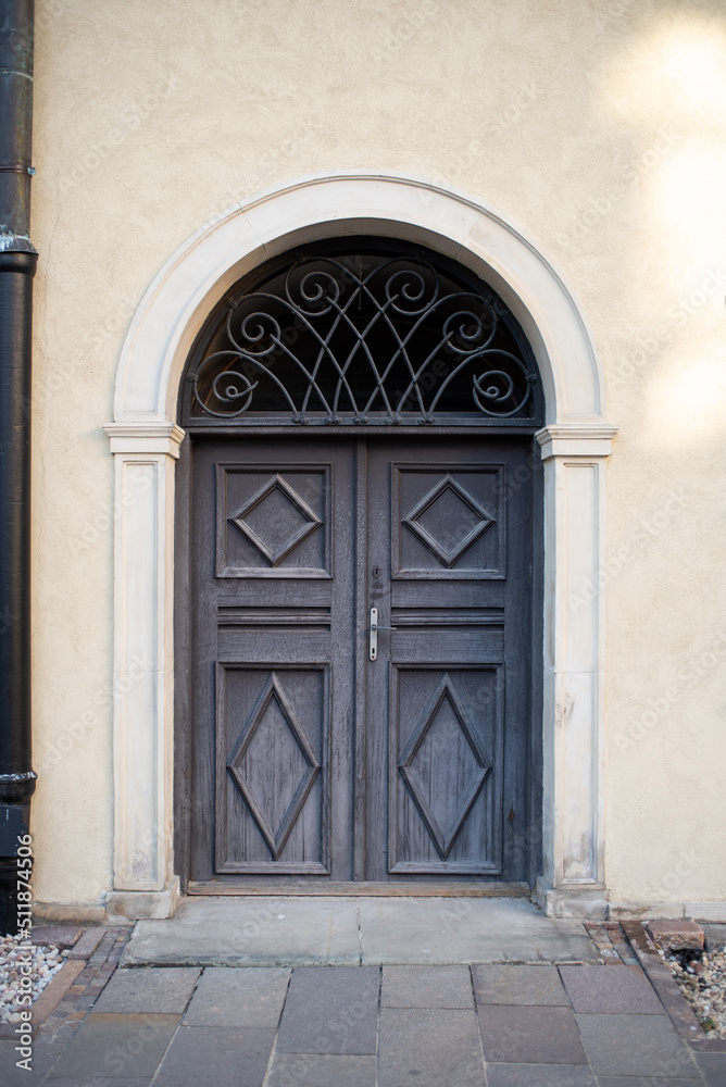 Fototapeta premium Modern baroque style blue wooden door in old stone white house. Poland, Warsaw.