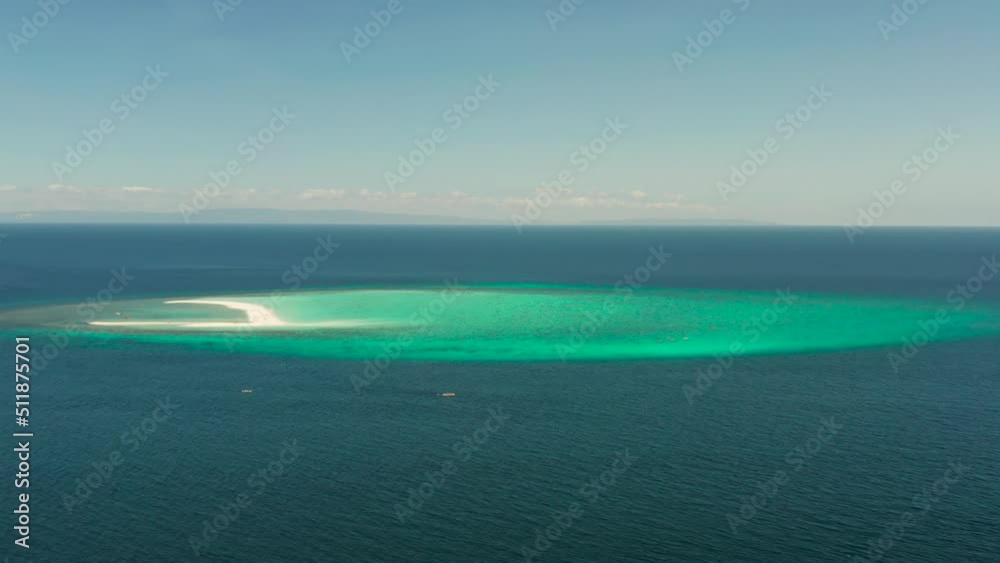 Sandy white island with beach and sandy bar in the turquoise atoll water, aerial drone. Sandbar Atoll. Tropical island and coral reef. Summer and travel vacation concept, Camiguin, Philippines. Sandy white island with beach and sandy bar in the turquoise atoll water, aerial drone. Sandbar Atoll. Tropical island and coral reef. Summer and travel vacation concept, Camiguin, Philippines.