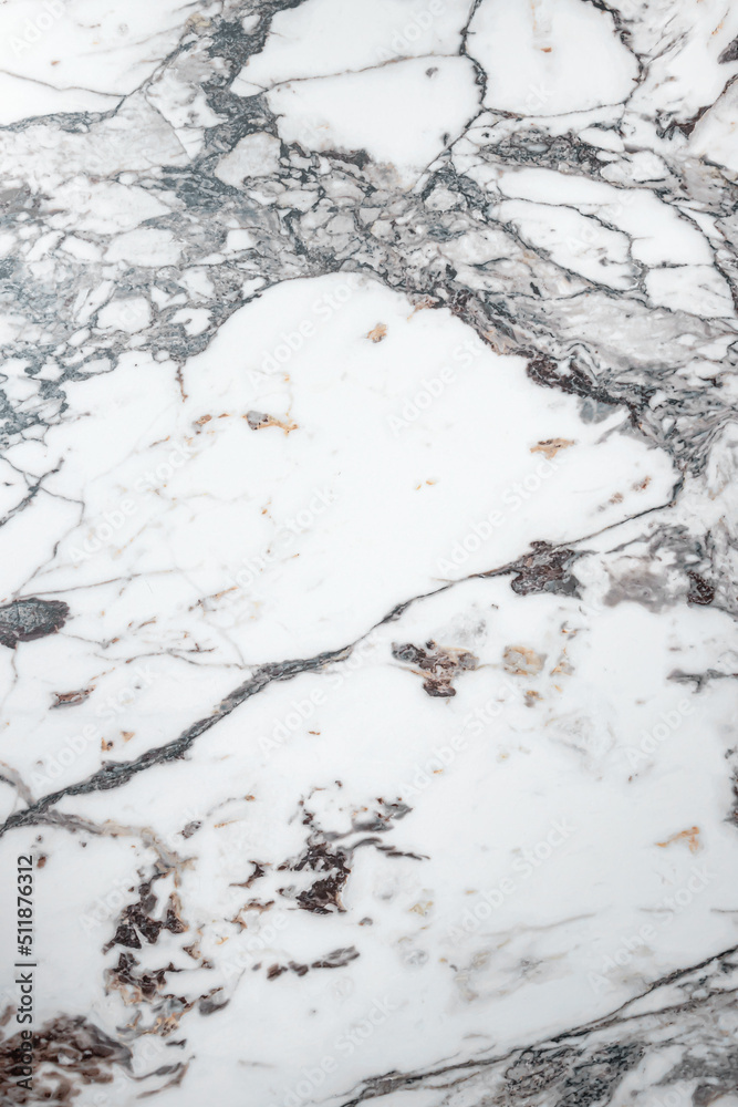 Obraz premium White marble stone texture top view. abstract pattern with grey and brown streaks for background or design art