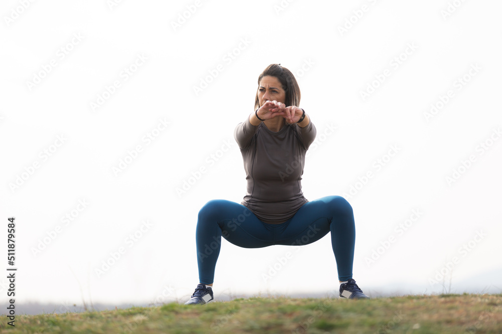 Squats exercise in the forest Squats exercise in the forest