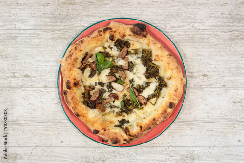 Italian handmade fresh pizza on wooden table high angle view