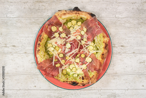 Italian handmade fresh pizza on wooden table high angle view