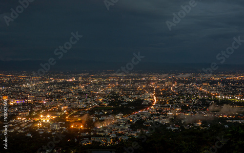 The view of the city in the evening from the mountain in Chiang Mai province , Thailand. © guidenuk