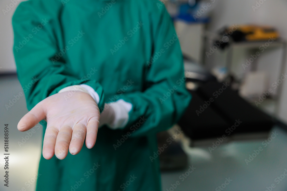 Close up hand with surgical gloves. woman Surgical doctor in Operating Theater ward at modern medical center.