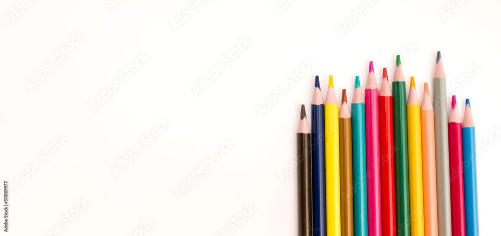 Fototapeta premium Top view on colorful pencils. Back to school.Supplies for art concept.Copyspace banner.Flat lay.Drawing