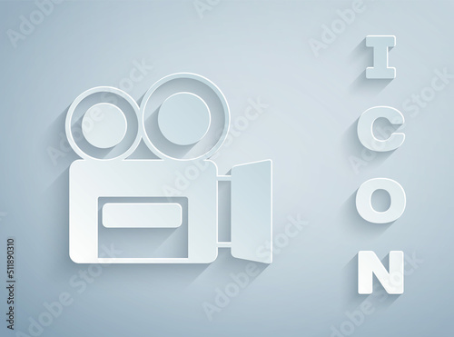 Paper cut Retro cinema camera icon isolated on grey background. Video camera. Movie sign. Film projector. Paper art style. Vector