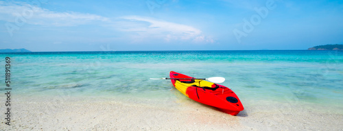 Kayak on the tropical white sand beach with transparent sea on sunny day, Panorama banner