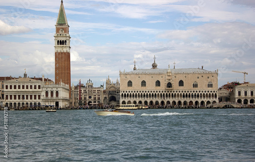 Venice, Italy: Famous city main attraction from a Sea viewpoint of Piazza San Marco and The Doge s Palace against dramatic sky photo