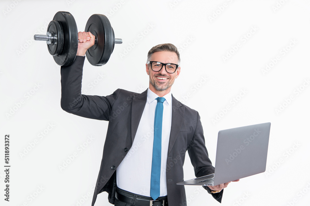 positive businessman in suit hold heavy dumbbell and laptop isolated on white background positive businessman in suit hold heavy dumbbell and laptop isolated on white background