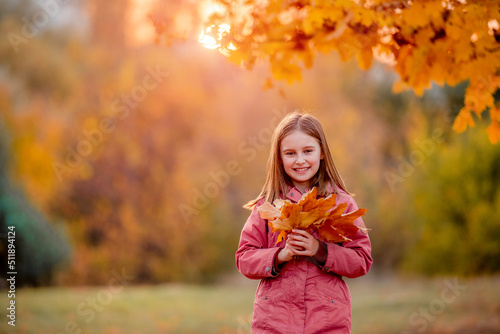 Preteen girl kid at autumn park