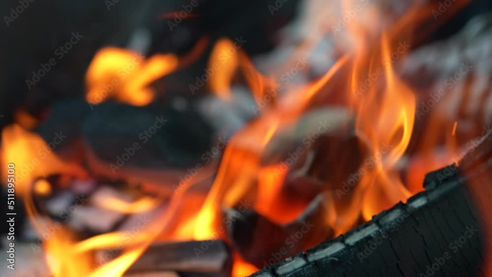 Close up defocused fire burning in fireplace. Flames with ember. Close up defocused fire burning in fireplace. Flames with ember.