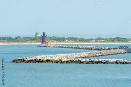 The East End Lighthouse sits at the end of the breakwater in Cape Henlopen State Park, Lewes, Delaware photo