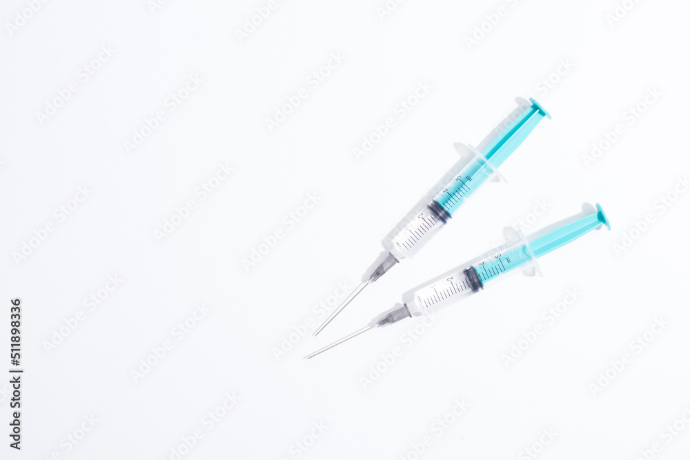 Medical plastic vaccination syringe isolated on a white background Medical plastic vaccination syringe isolated on a white background