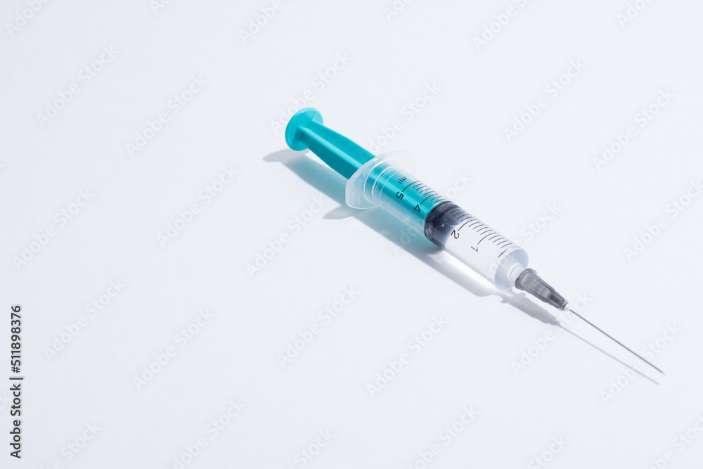 Medical plastic vaccination syringe isolated on a white background Medical plastic vaccination syringe isolated on a white background