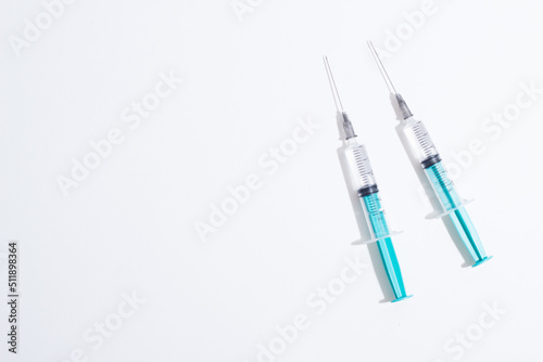 Medical plastic vaccination syringe isolated on a white background