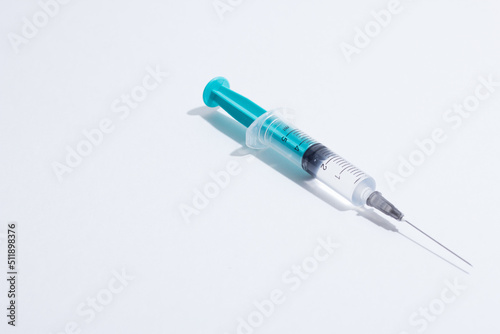 Medical plastic vaccination syringe isolated on a white background