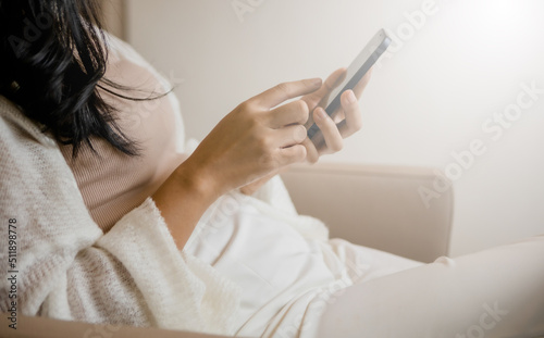 online payment woman holding credit card and smartphone and the light from the beautiful window online shopping concept