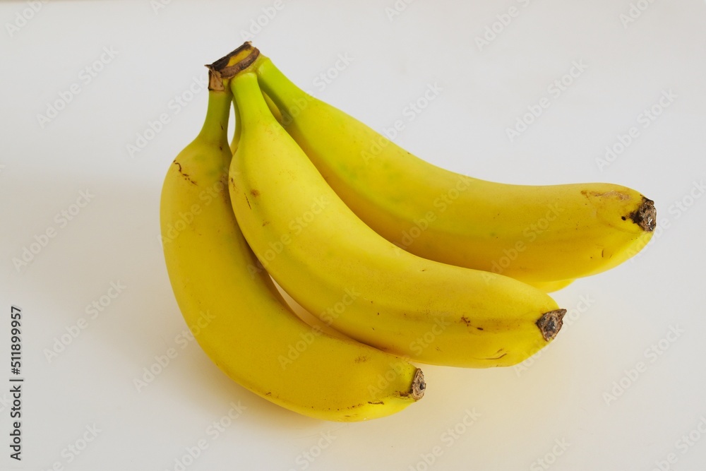 Banana bunch on white surface