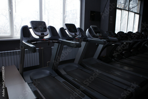 Empty treadmills in a row at the gym