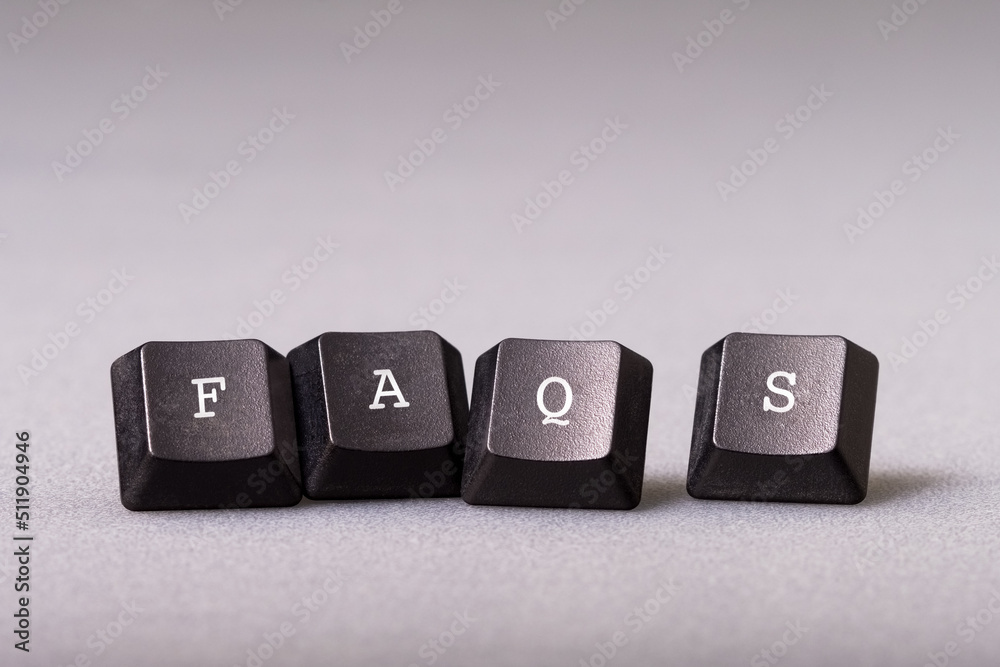 FAQs, Frequently Asked Questions, by a piece of computer keyboard FAQs, Frequently Asked Questions, by a piece of computer keyboard