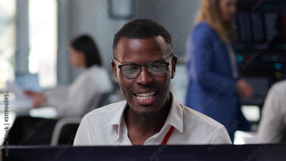 Close up of smiling African-American businessman having video conference Close up of smiling African-American businessman having video conference