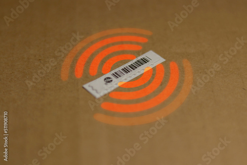 Used RFID sticker or tag on a brown surface