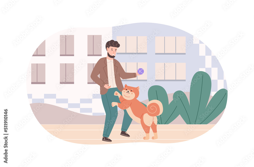 Cheerful man playing and training his dog outdoors