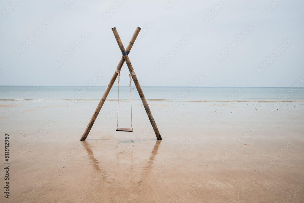 A swing is seen on a beach