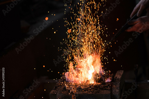 bright fire in the forge with sparks