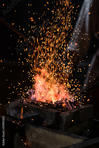 bright fire in the forge with sparks