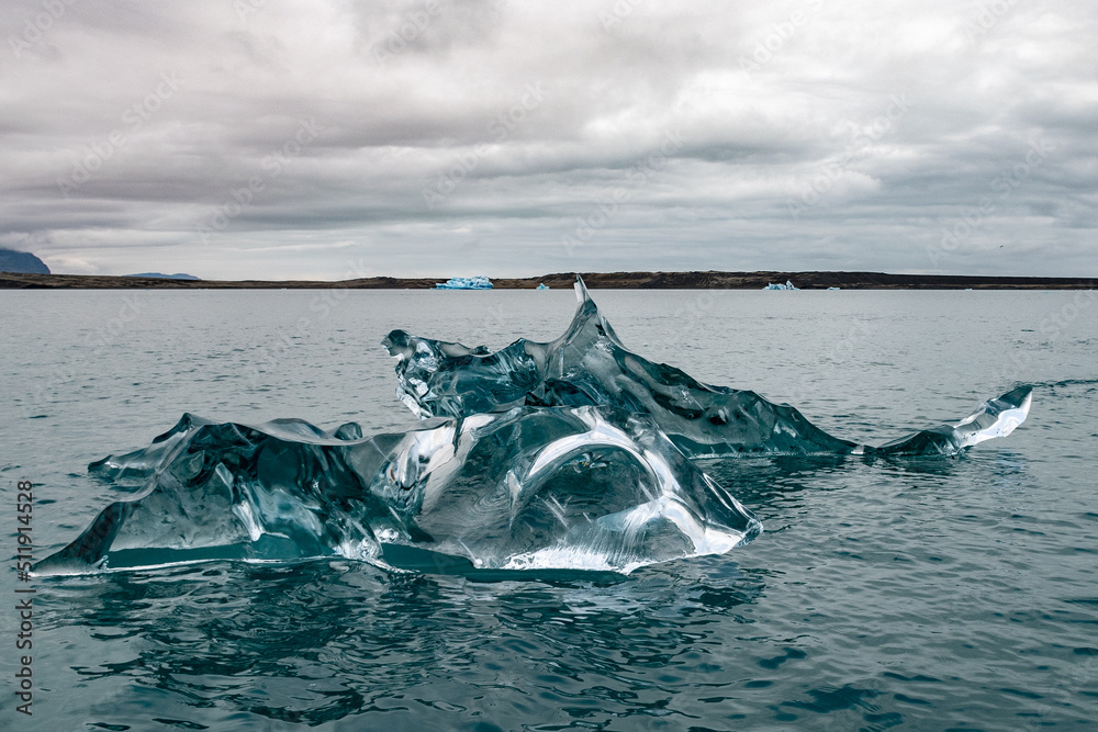 Fototapeta premium Small transparent iceberg in the Jokulsarlon lagoon, in southern Iceland