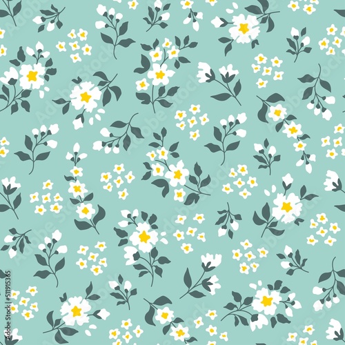 Seamless pattern of a little flowers and branch with leaves. Abstract small flower patter. Vector illustration.