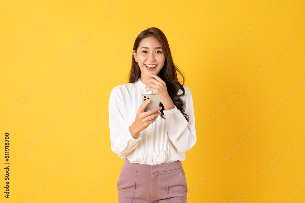 Smiling asian woman white shirt on yellow background Smiling asian woman white shirt on yellow background