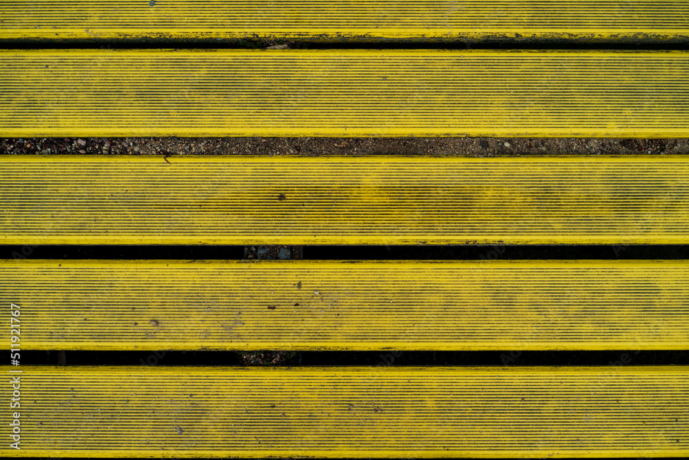 wooden boards painted yellow. background texture. 