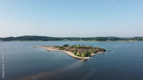 Drone flight over a small reserve island in a fjord with exclusivly birds living on it