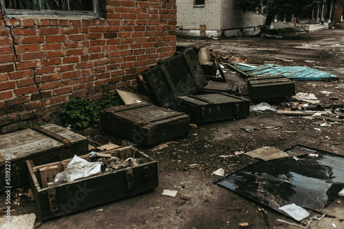 Boxes with weapons left by Russian troops in a Ukrainian village